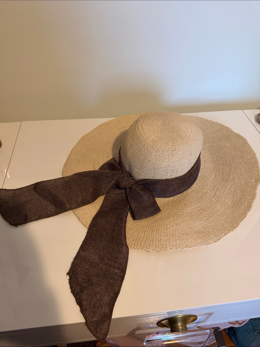 Beige Straw Wide-Brim Hat with Brown Ribbon Accent